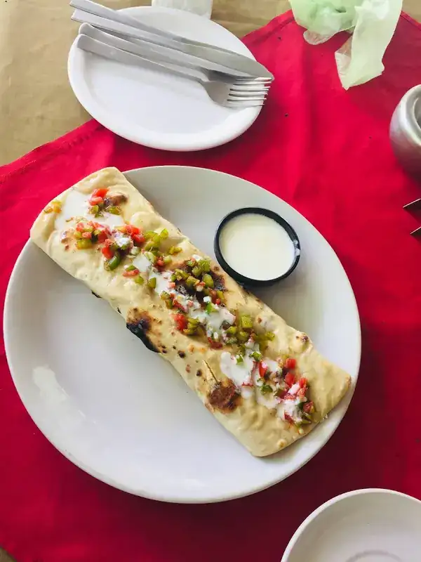 Breakfast burrito with salsa & yoghurt dip